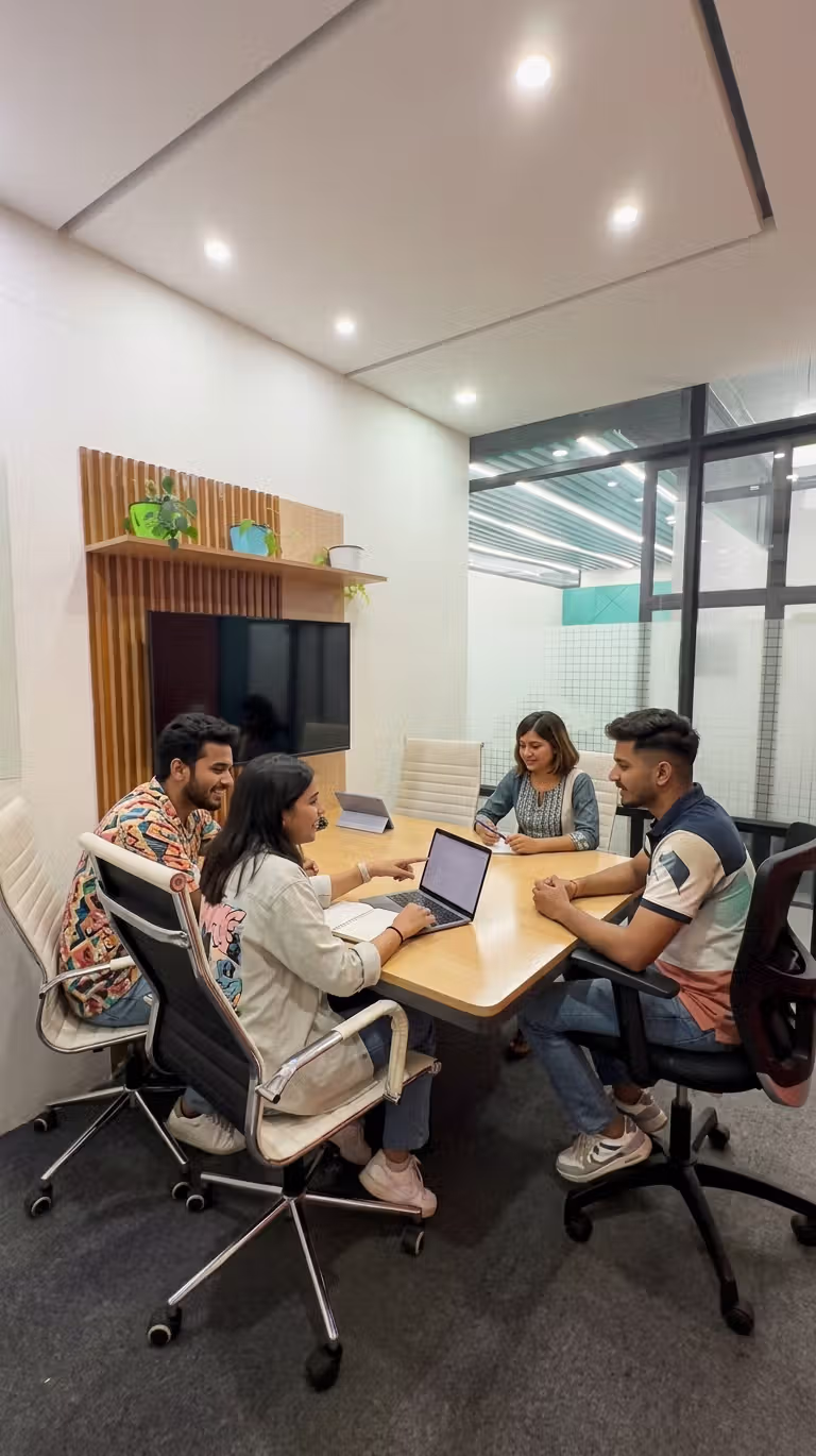 Team discussion in coworking space meeting room